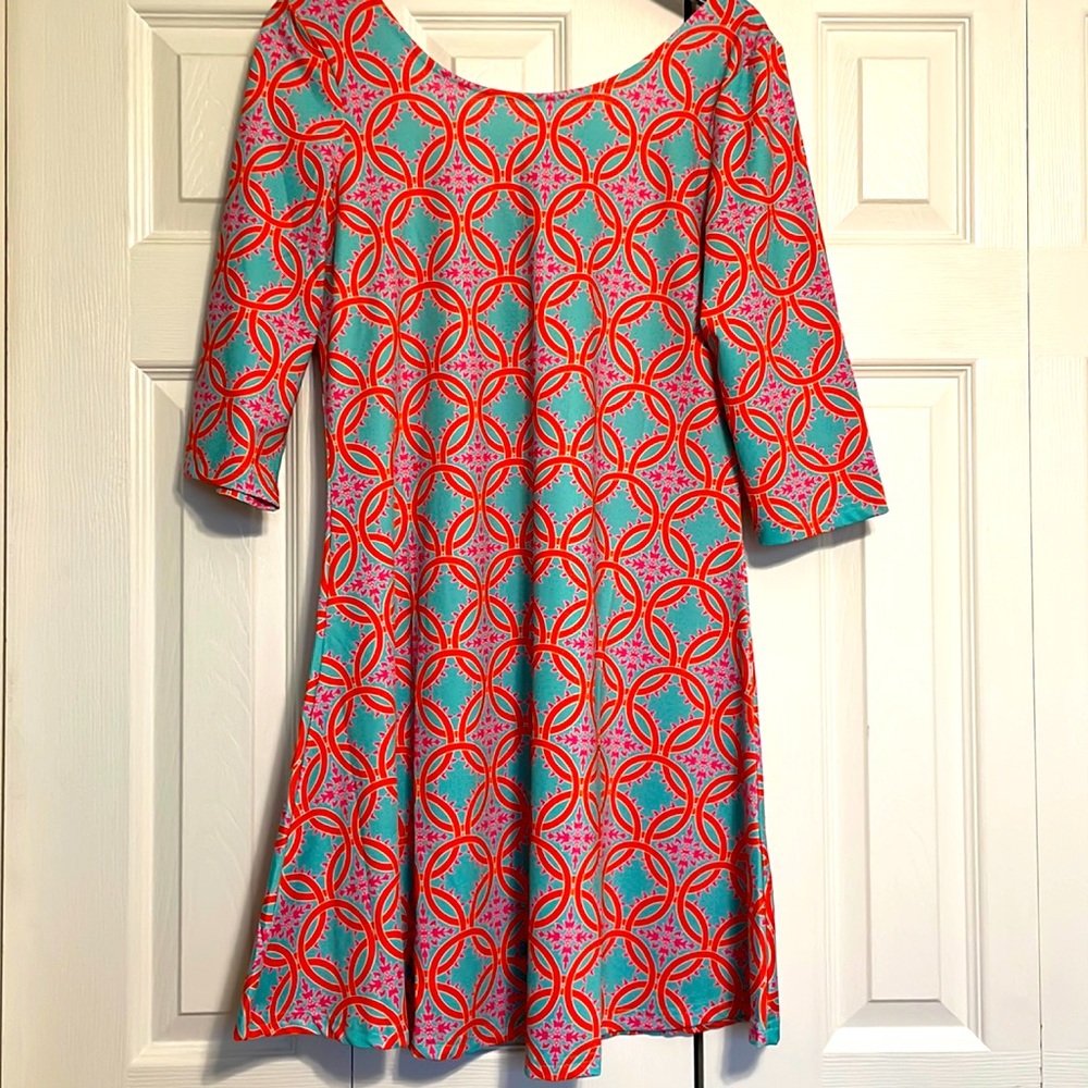 Tracy Negoshian coral shift dress.